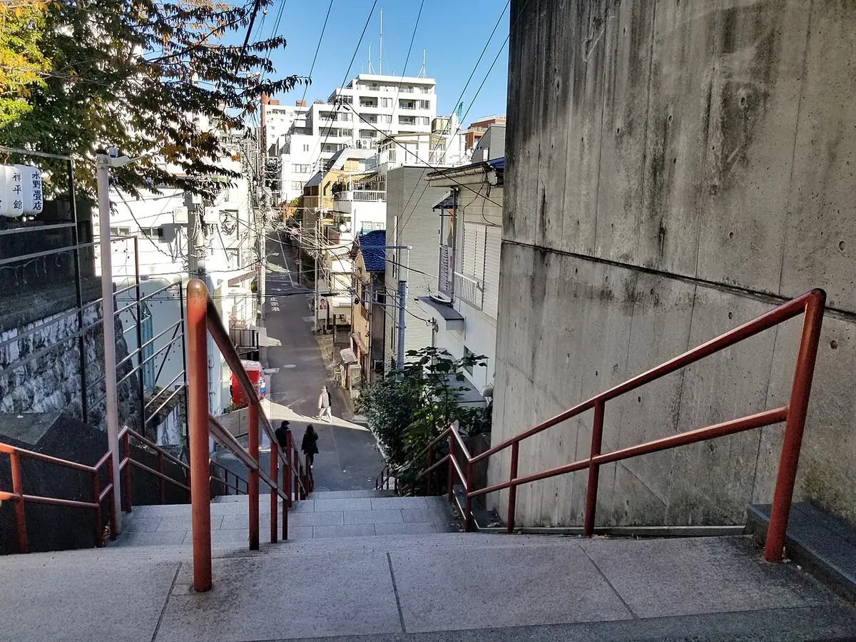 A Tokyo residential street seen from the red-railed stairs of Suga Shrine in Yotsuya