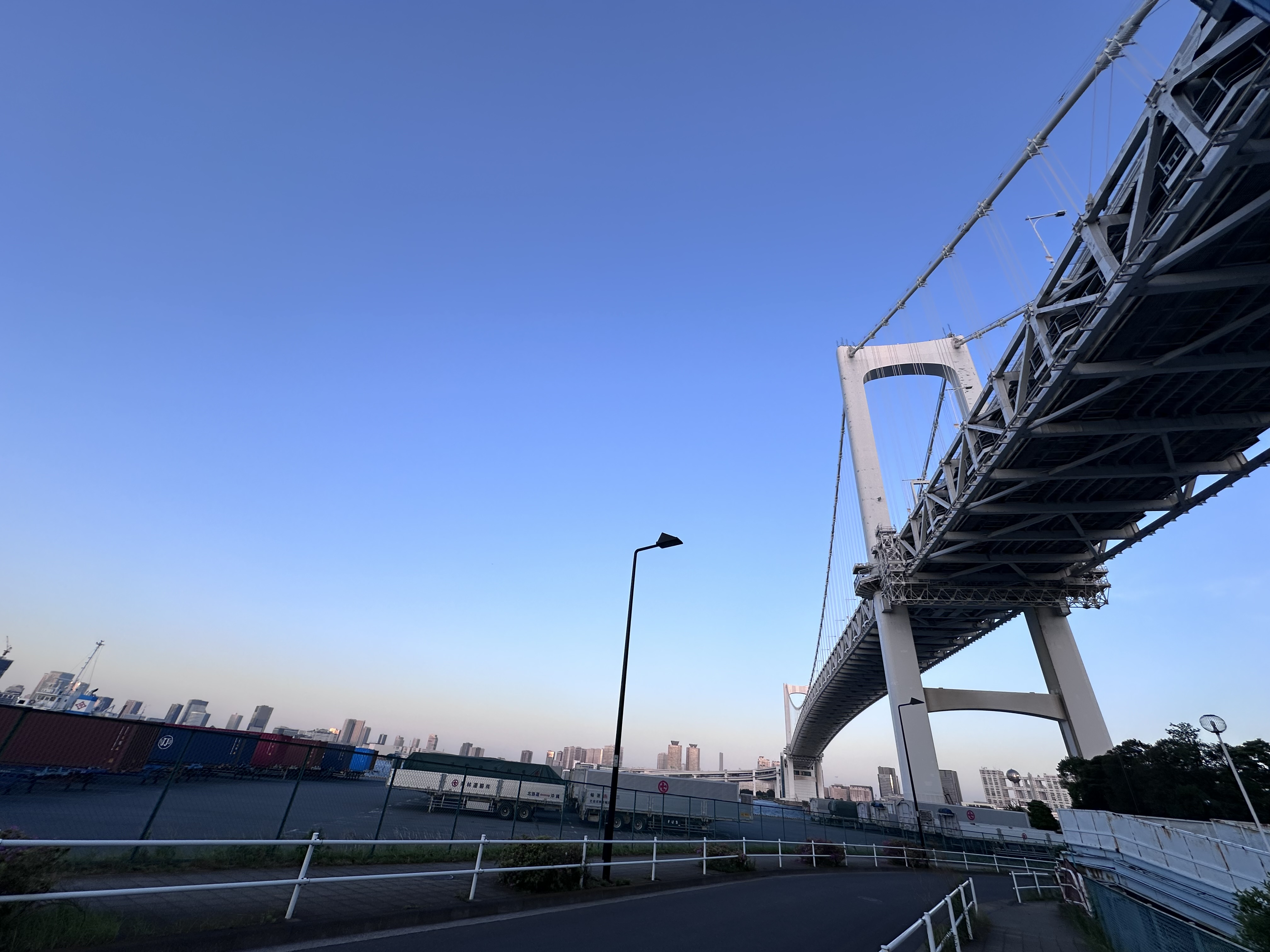 Road running beneath Rainbow Bridge in the evening